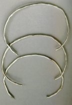 Photograph of three silver anklets &copy; Fodor, Istv�n Ed. The Ancient Hungarians Budapest: Hungarian National Museum, 1996